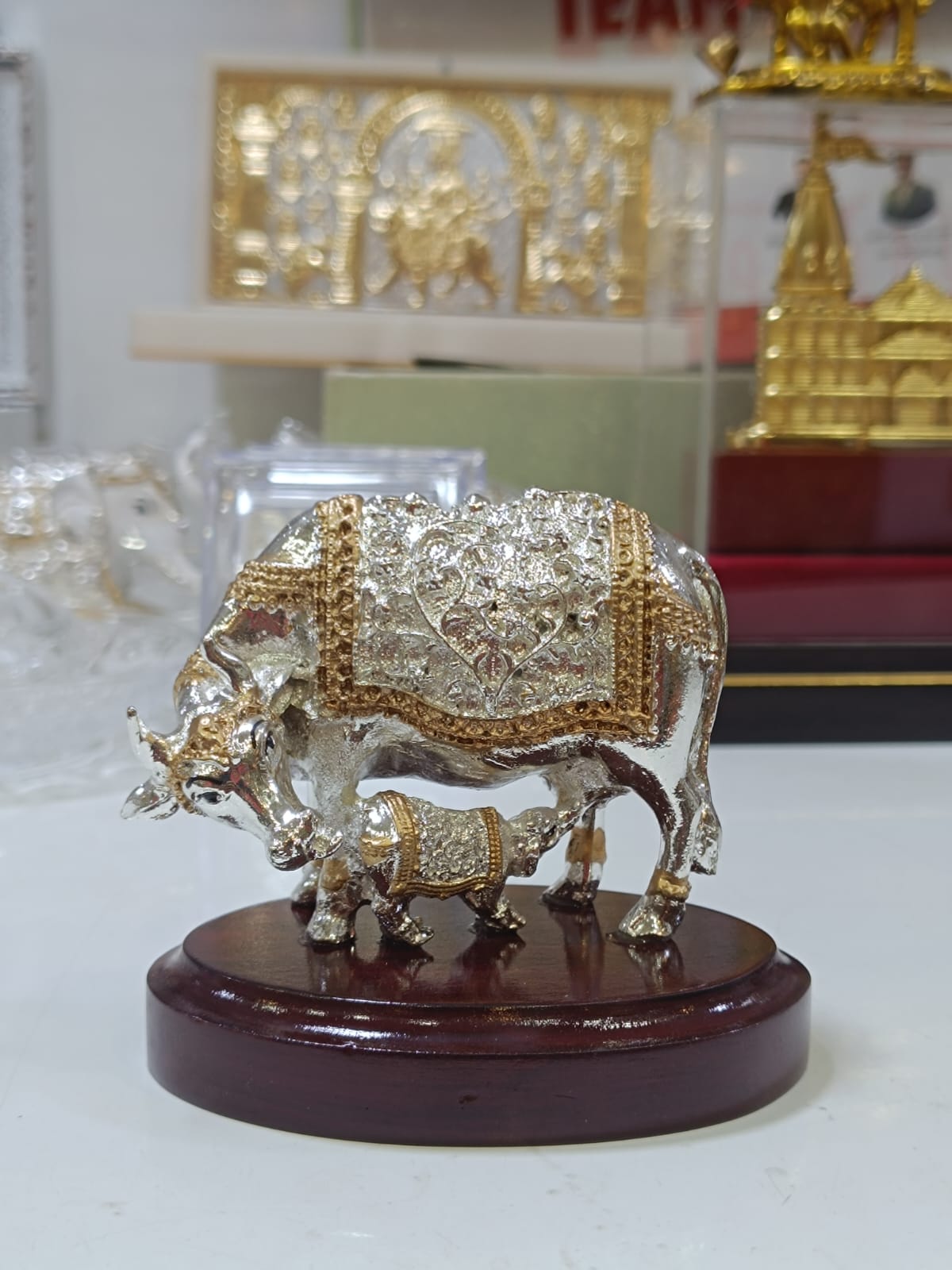 Silver Coated Cow with Calf Idol on Wooden Base | Auspicious Kamdhenu Decorative Showpiece for Home & Office | Premium Spiritual Gift by Reshamm